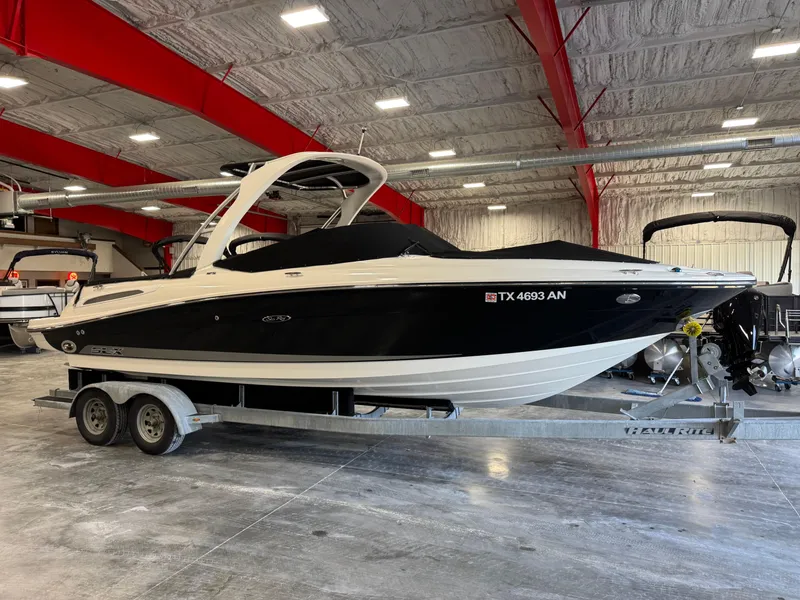 Slide: The Image of 2007 Sea Ray 250 SLX boat on trailer in indoor storage facility. - 11