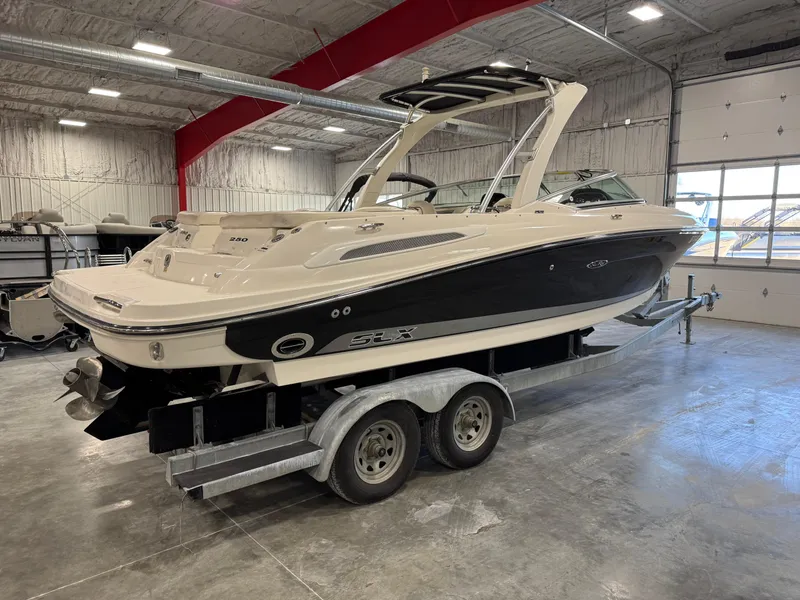 Slide: The Image of 2007 Sea Ray 250 SLX boat on trailer in indoor storage facility. - 15