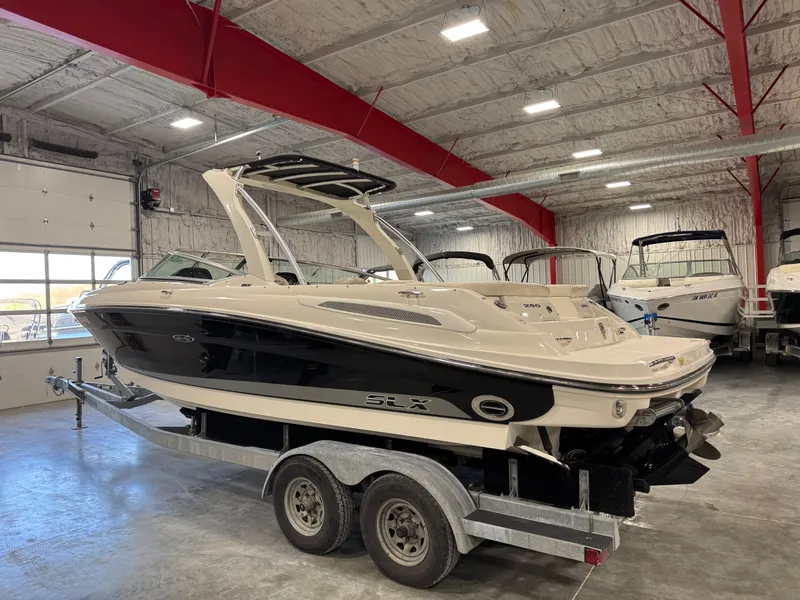 Slide: The Image of 2007 Sea Ray 250 SLX boat on trailer in indoor storage facility. - 3