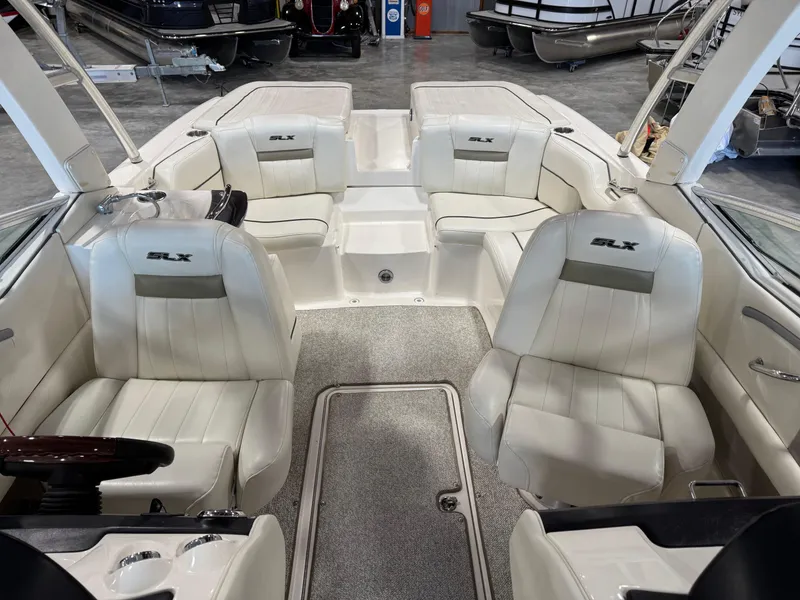 Slide: The Image of Interior of a 2007 Sea Ray 250 SLX boat with white leather seating. - 5