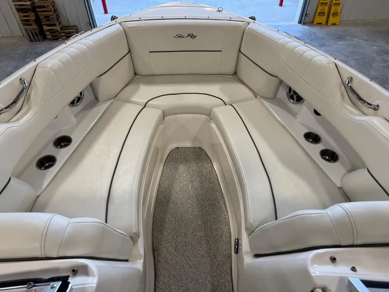 Slide: The Image of 2007 Sea Ray 250 SLX boat interior with white leather seating and carpeted floor. - 6