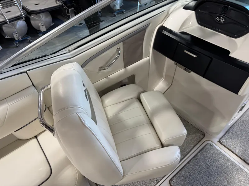 Slide: The Image of Interior of 2007 Sea Ray 250 SLX boat with white leather seating. - 7