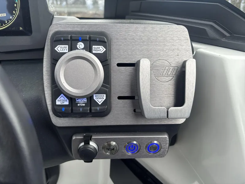 Slide: The Image of Control panel of a 2022 Malibu 21lx boat with surf and wedge adjustments. - 13