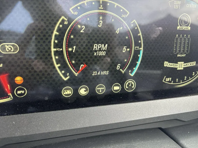 Slide: The Image of Dashboard of a 2022 Malibu 21lx boat showing RPM and engine hours. - 14