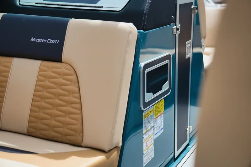 Slide: The Image of Interior of 2025 MasterCraft X22 with beige and blue upholstery. - 16