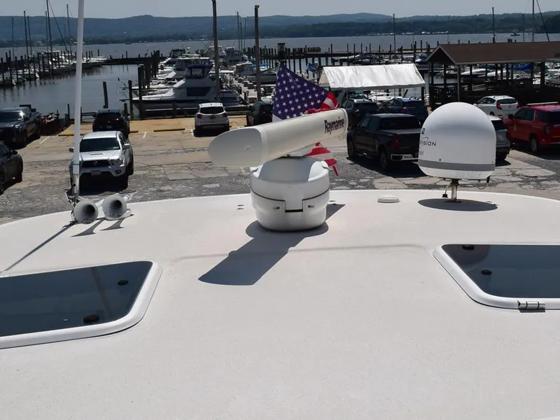 Slide: The Image of 2006 Tiara Yachts 3200 Open at marina with radar and American flag. - 15