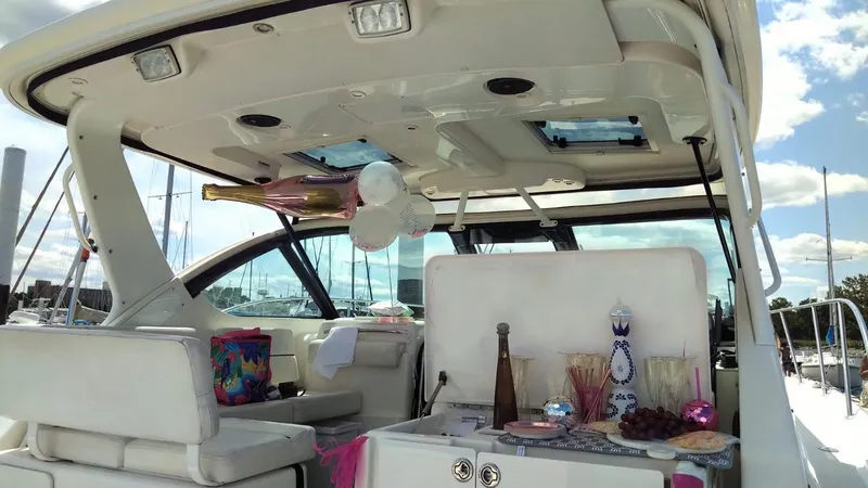 Slide: The Image of 2006 Tiara Yachts 3200 Open with party setup, balloons, and refreshments on deck. - 16