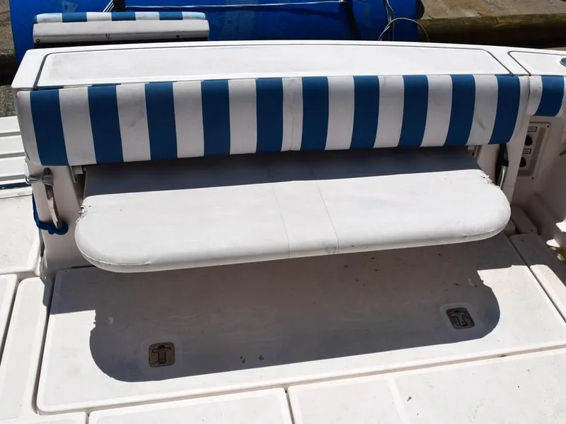 Slide: The Image of 2006 Tiara Yachts 3200 Open, striped blue and white seating on deck. - 27