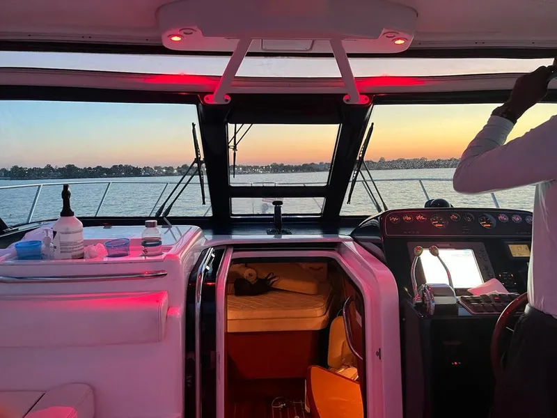 Slide: The Image of 2006 Tiara Yachts 3200 Open interior with sunset view through the windshield. - 34