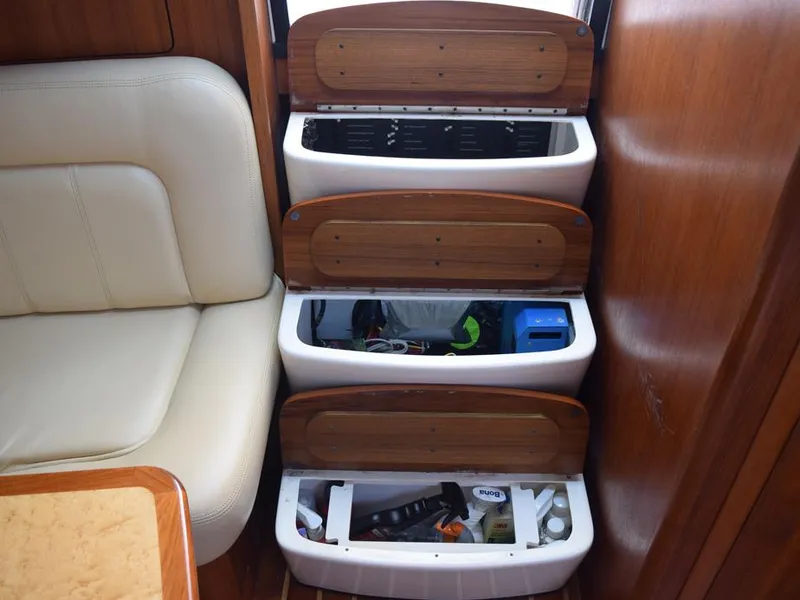 Slide: The Image of 2006 Tiara Yachts 3200 Open interior storage compartments with wooden lids. - 43