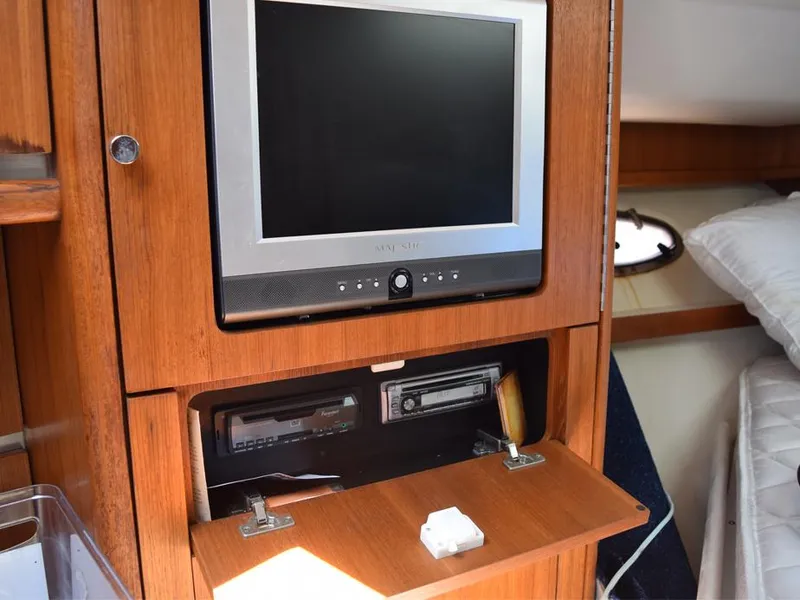 Slide: The Image of 2006 Tiara Yachts 3200 Open interior with TV and entertainment system. - 44