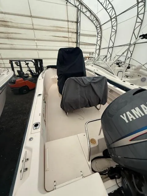 Slide: The Image of 2005 Grady-White 180 Sportsman boat with Yamaha engine in covered storage. - 2