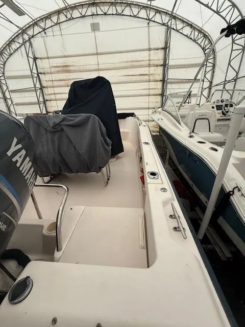 Slide: The Image of 2005 Grady-White 180 Sportsman boat in covered storage, featuring Yamaha engine. - 3