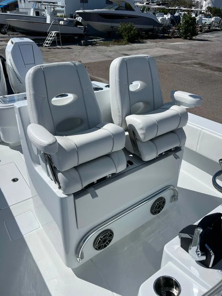 Slide: The Image of Luxury seating on 2025 Contender 32 ST boat with sleek white design. - 6