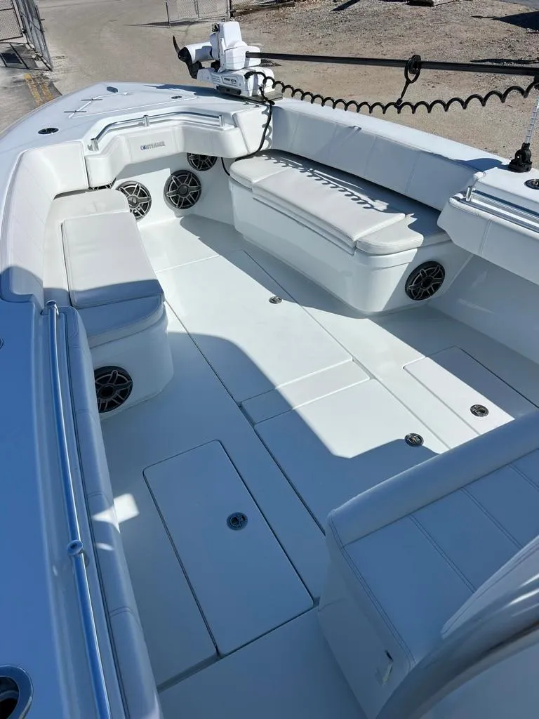 Slide: The Image of 2025 Contender 32 ST boat interior with white seating and modern design. - 7