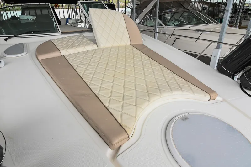 Slide: The Image of 2005 Cruisers Yachts 370 Express sunpad with quilted design on deck. - 26