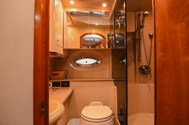 Slide: The Image of Luxurious bathroom in 2005 Cruisers Yachts 370 Express with shower and elegant wood finishes. - 42