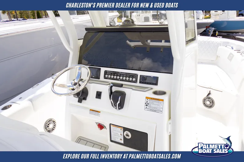Slide: The Image of 2025 Sea Fox 228 Commander boat dashboard with steering wheel and controls. - 10
