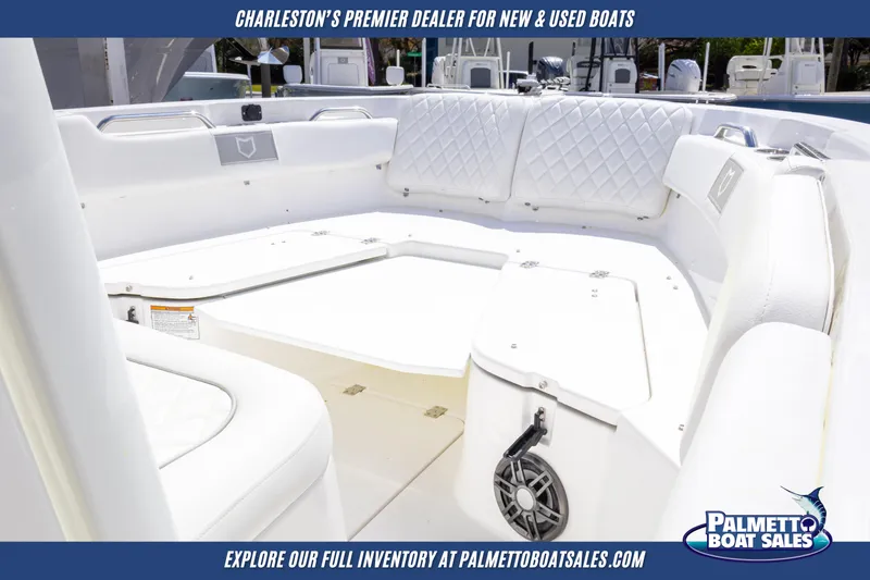Slide: The Image of 2025 Sea Fox 228 Commander boat interior with white seating, showcased by Palmetto Boat Sales. - 11