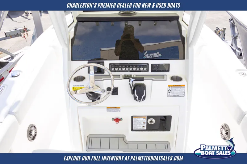 Slide: The Image of 2025 Sea Fox 228 Commander boat dashboard with steering wheel and controls. - 15