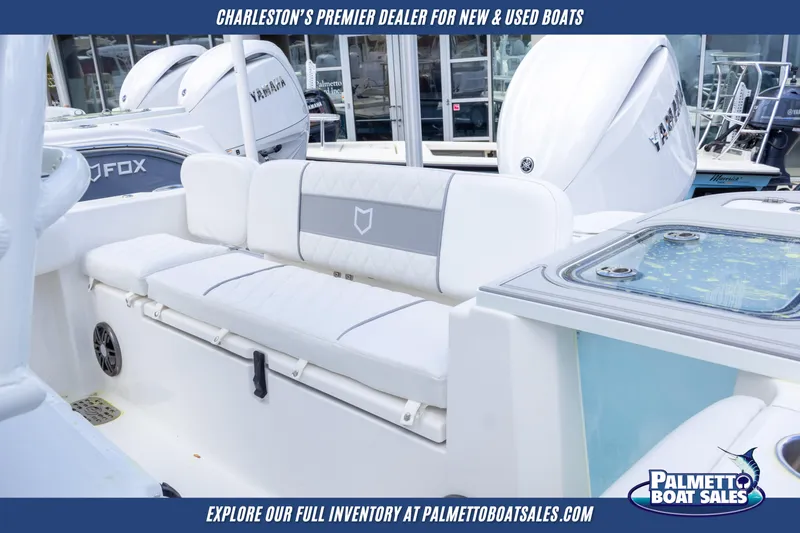 Slide: The Image of 2025 Sea Fox 228 Commander boat interior with seating, showcased by Palmetto Boat Sales. - 17