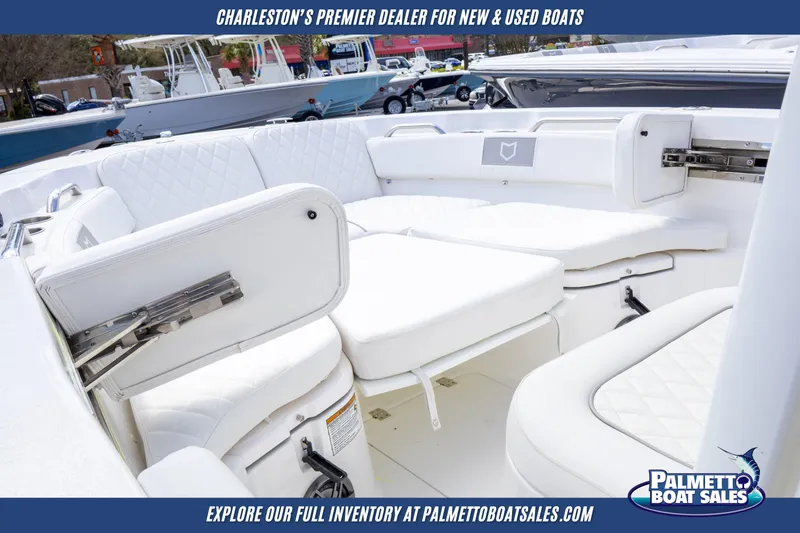 Slide: The Image of 2025 Sea Fox 228 Commander boat interior with white seating, showcased by Palmetto Boat Sales. - 18