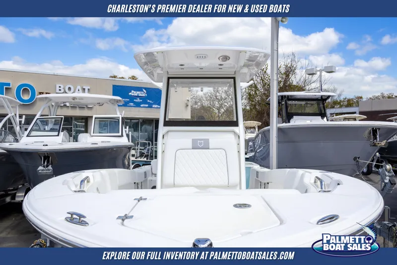 Slide: The Image of 2025 Sea Fox 228 Commander boat displayed at Palmetto Boat Sales dealership. - 2