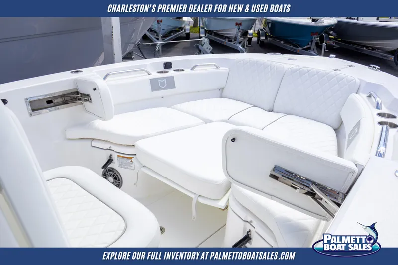 Slide: The Image of 2025 Sea Fox 228 Commander boat interior with white seating, showcased by Palmetto Boat Sales. - 20