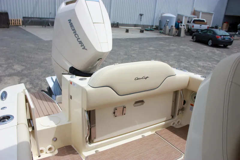 Slide: The Image of 2024 Chris-Craft Catalina 24 boat with Mercury engine, rear seating view. - 10