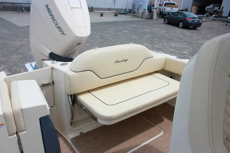 Slide: The Image of 2024 Chris-Craft Catalina 24 boat with Mercury engine and beige seating. - 11