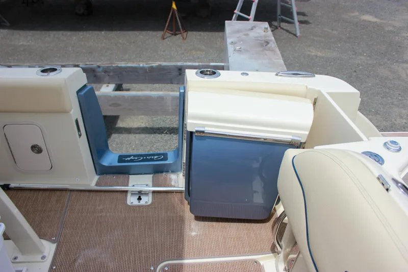 Slide: The Image of 2024 Chris-Craft Catalina 24 interior with seating and storage features. - 13