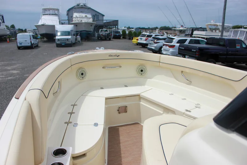 Slide: The Image of 2024 Chris-Craft Catalina 24 boat interior with seating, parked in a marina. - 15