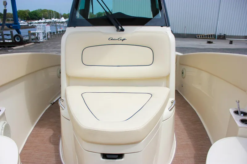 Slide: The Image of 2024 Chris-Craft Catalina 24 boat interior with beige seating and sleek design. - 18