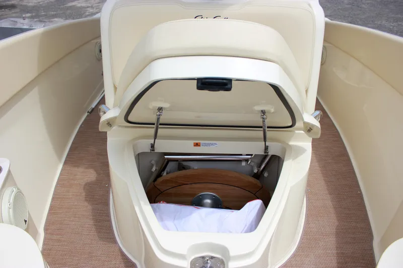 Slide: The Image of 2024 Chris-Craft Catalina 24 boat storage compartment with open hatch, showcasing interior details. - 19