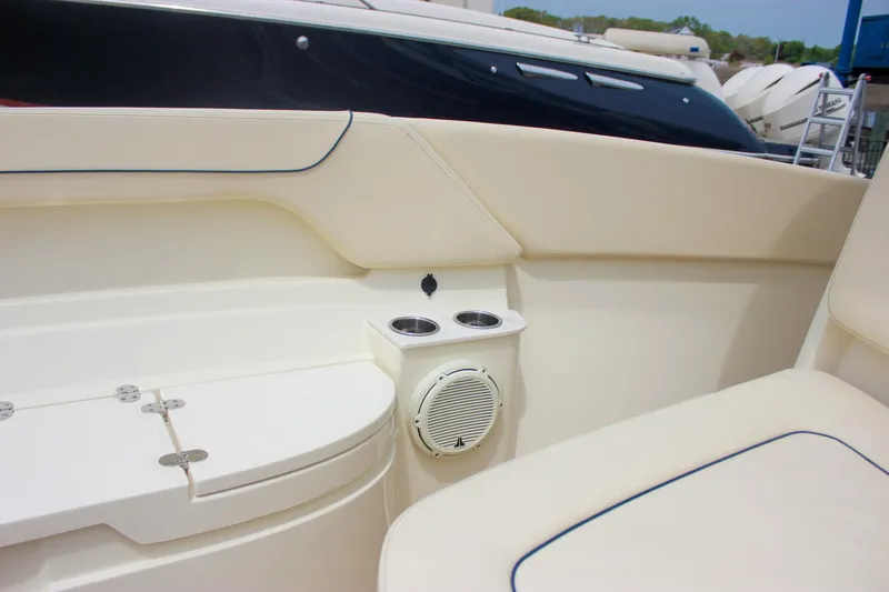 Slide: The Image of 2024 Chris-Craft Catalina 24 interior with cup holders and speaker detail. - 21