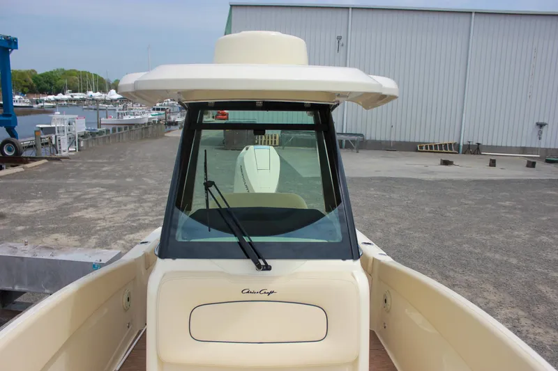 Slide: The Image of 2024 Chris-Craft Catalina 24 boat at dock, featuring sleek design and spacious deck. - 22