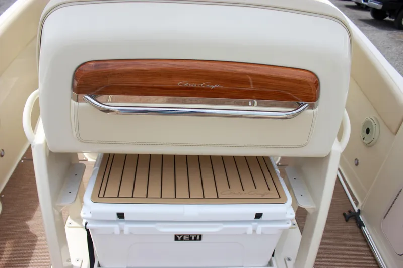 Slide: The Image of 2024 Chris-Craft Catalina 24 boat interior with Yeti cooler and wooden accents. - 27