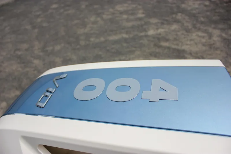 Slide: The Image of 2024 Chris-Craft Catalina 24 boat engine cover with blue and white design. - 41