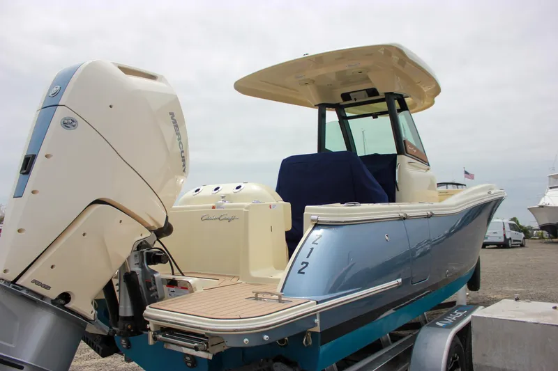 Slide: The Image of 2024 Chris-Craft Catalina 24 boat with outboard motor, docked on a trailer. - 45