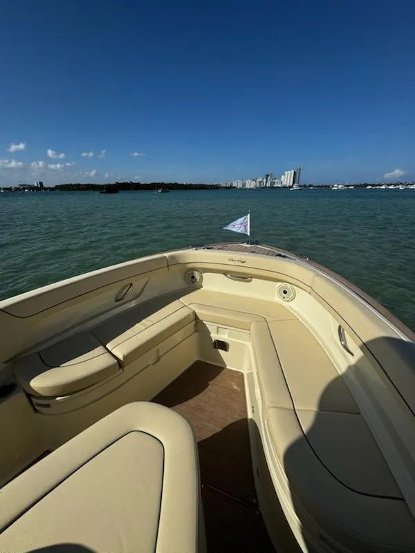 Slide: The Image of 2024 Chris-Craft Catalina 24 boat interior with waterfront city skyline view. - 56