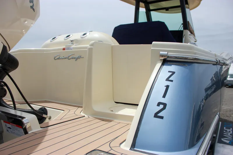 Slide: The Image of 2024 Chris-Craft Catalina 24 boat, rear view, showcasing elegant design and branding details. - 7