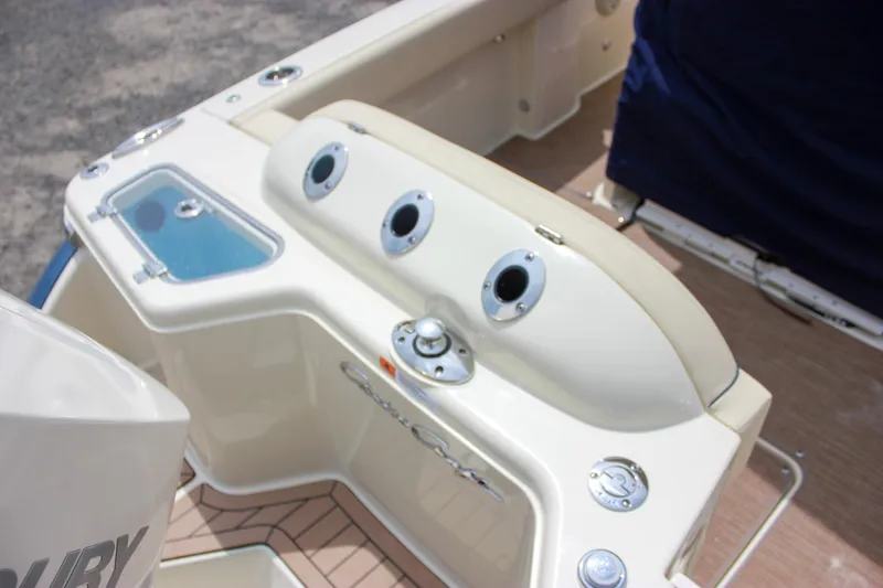 Slide: The Image of 2024 Chris-Craft Catalina 24 boat interior with fishing rod holders and storage compartments. - 8