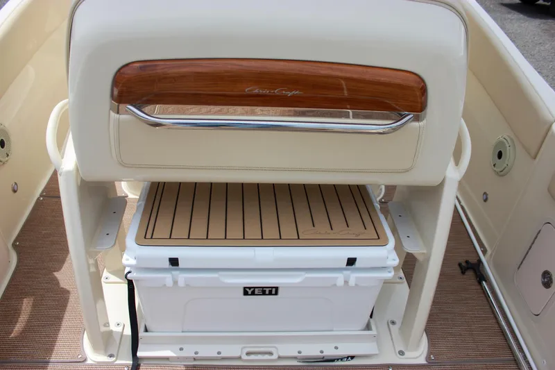 Slide: The Image of 2024 Chris-Craft Catalina 24 boat interior with Yeti cooler and wooden accents. - 9