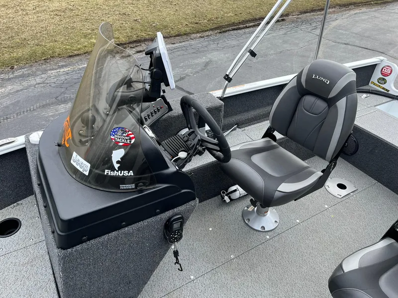 Slide: The Image of 2023 Lund 1650 Rebel XL SS boat interior with steering console and seat. - 10
