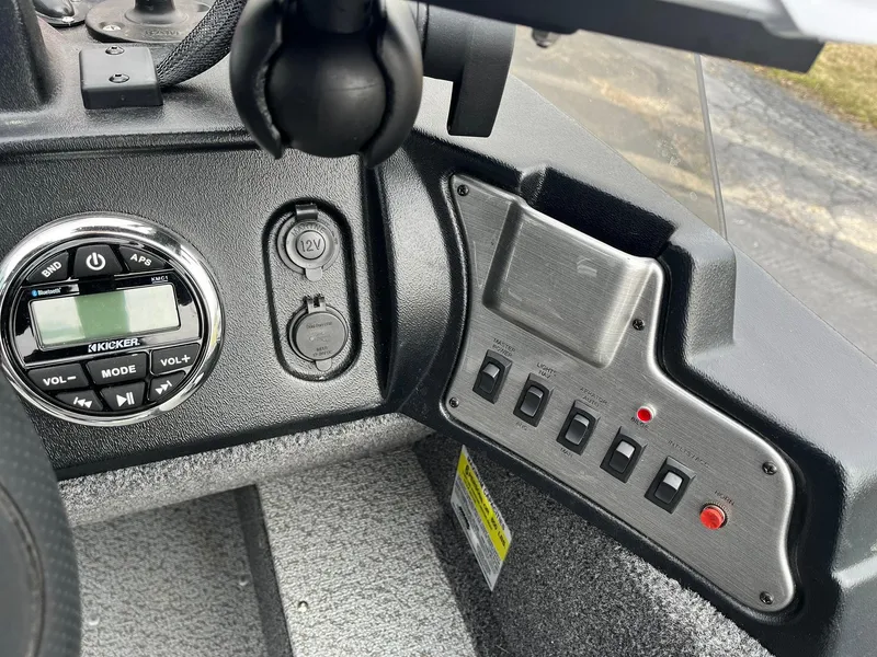 Slide: The Image of 2023 Lund 1650 Rebel XL SS dashboard with controls and audio system. - 15