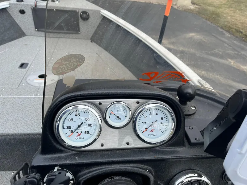 Slide: The Image of 2023 Lund 1650 Rebel XL SS dashboard with speedometer and tachometer gauges. - 16
