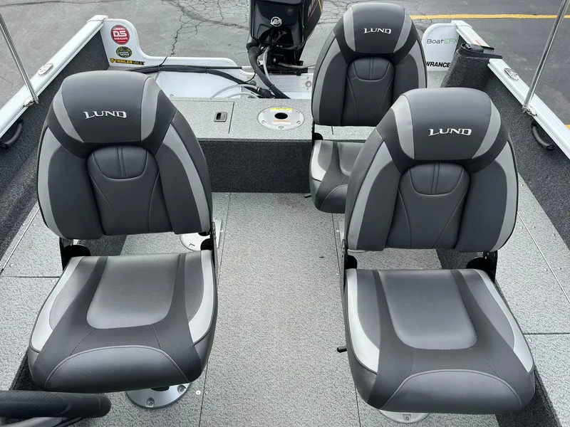 Slide: The Image of 2023 Lund 1650 Rebel XL SS boat interior with four cushioned seats. - 19