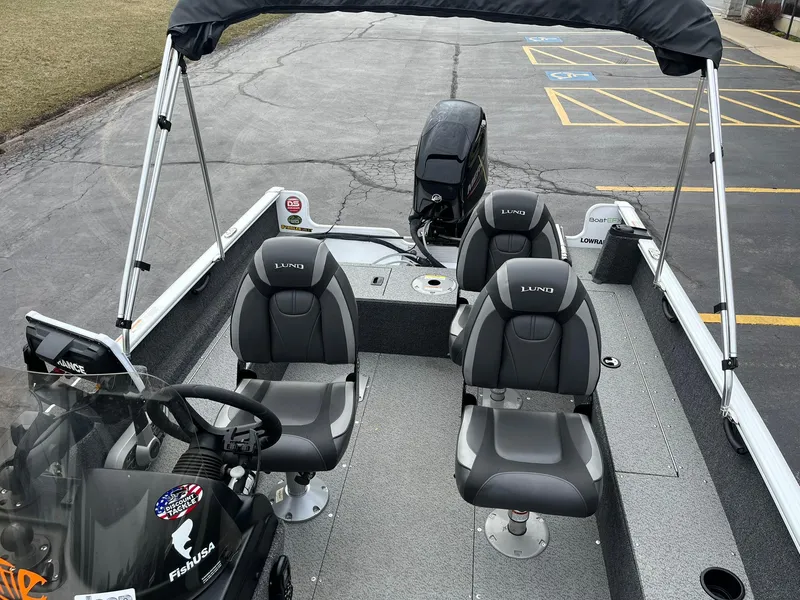 Slide: The Image of 2023 Lund 1650 Rebel XL SS boat interior with seating and steering console. - 9