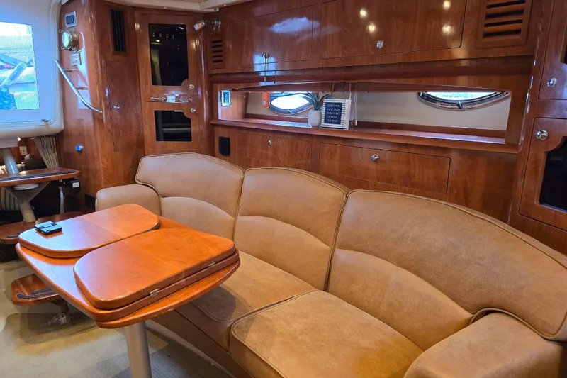 Slide: The Image of Luxurious interior of 2007 Four Winns 358 Vista yacht with plush seating and wooden accents. - 13