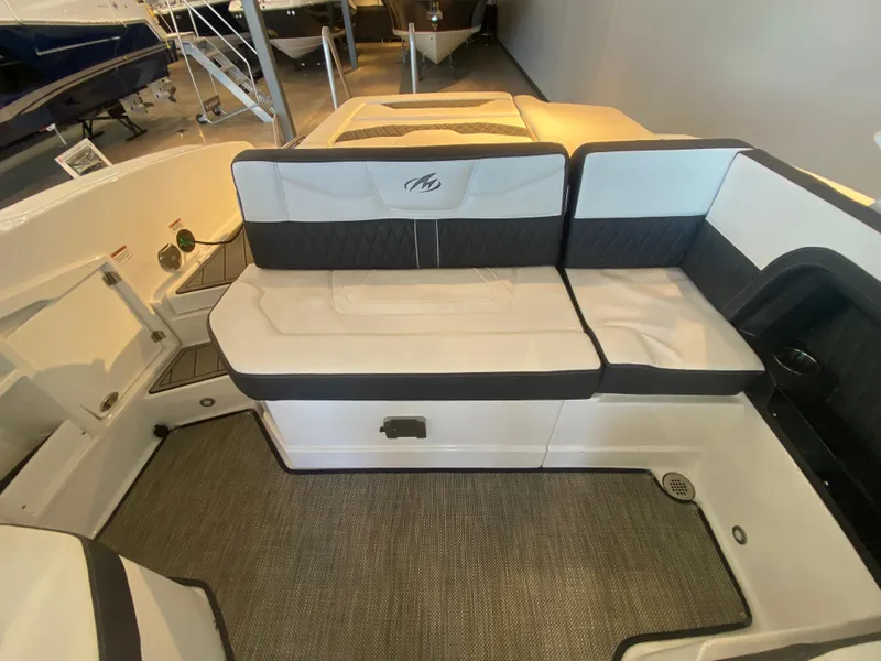 Slide: The Image of 2023 Monterey 298 SUPER SPORT BR boat interior with cushioned seating and modern design. - 15